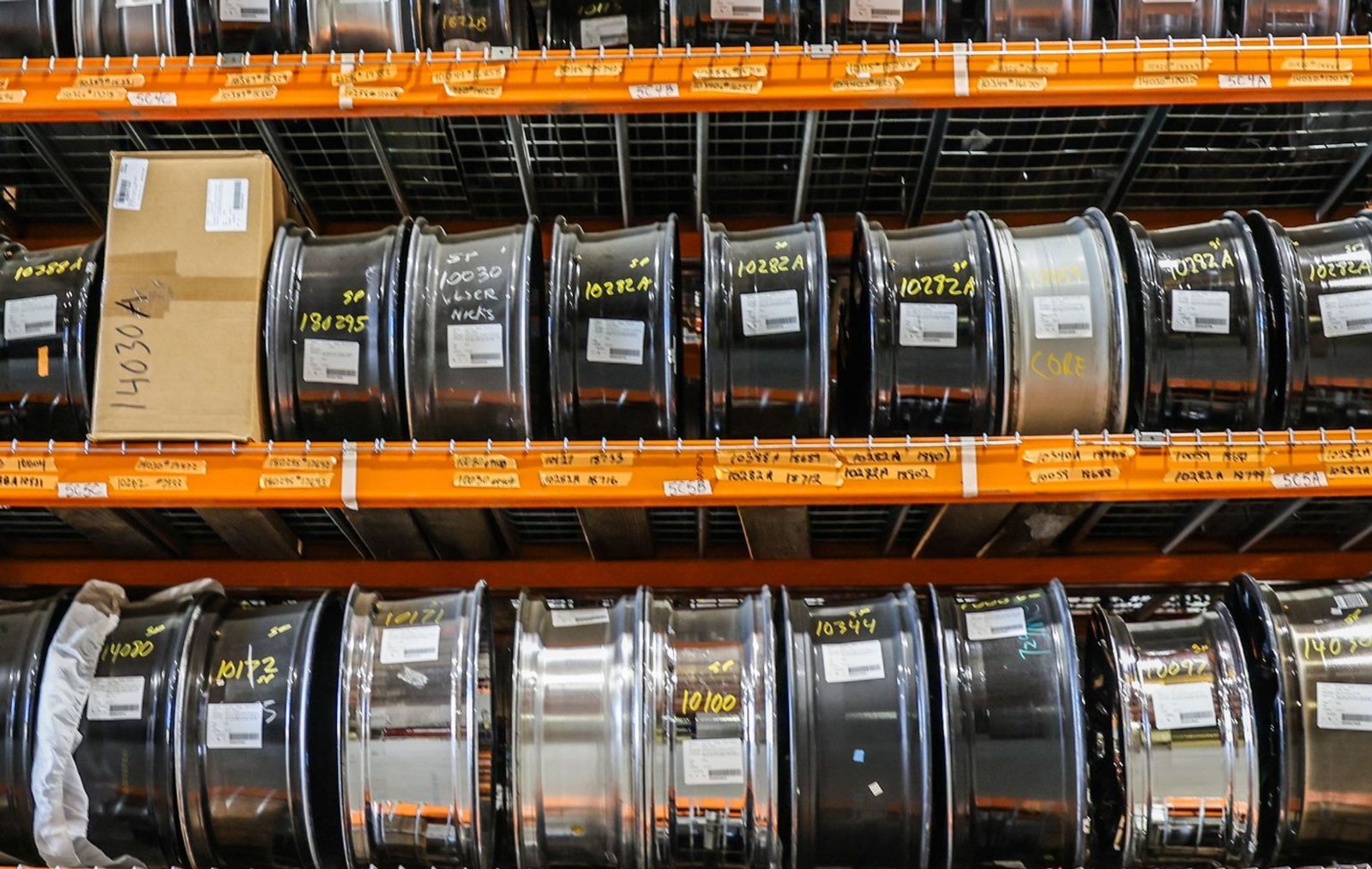 A wall of wheels and rims in a tyre shop